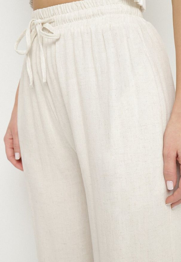 Born2be - Jasnobeżowe Szerokie Spodnie Typu Palazzo z Wysokim Stanem i Wiązaniem Sonalissa. Okazja: na co dzień. Stan: podwyższony. Kolor: beżowy. Styl: casual, boho