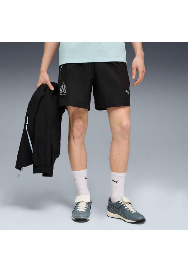 Puma - Tkanina OM Woven 2025/26. Kolor: czarny. Materiał: tkanina. Sport: piłka nożna