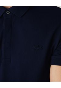Lacoste - LACOSTE - Granatowy t-shirt polo z bawełnianej piki Regular Fit. Okazja: na spotkanie biznesowe, do pracy. Typ kołnierza: polo. Kolor: niebieski. Materiał: bawełna. Styl: biznesowy, sportowy #4
