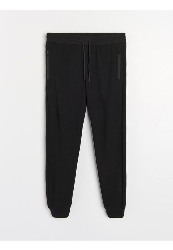 Sinsay - Strukturalne spodnie regular fit - czarny. Kolor: czarny