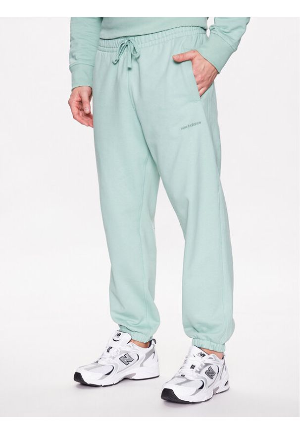 New Balance Spodnie dresowe MP23551 Zielony Relaxed Fit. Kolor: zielony. Materiał: bawełna