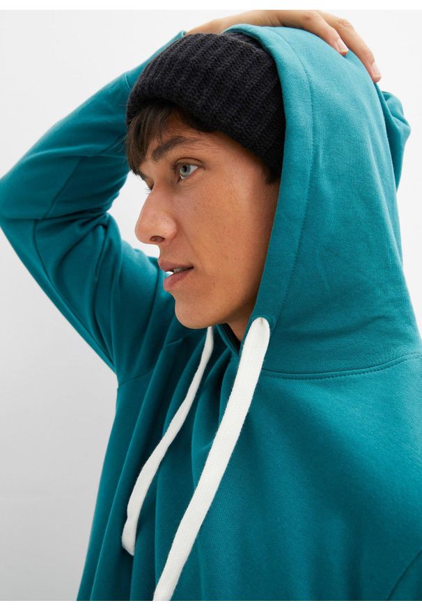 bonprix - Bawełniana bluza z kapturem. Typ kołnierza: kaptur. Kolor: niebieski. Materiał: bawełna. Wzór: prążki