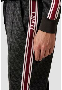Guess - GUESS Czarne męskie spodnie dresowe z lampasami w monogram Parimo 4G, Rozmiar XXL. Kolor: czarny. Materiał: dresówka #2