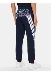Adidas - adidas Spodnie dresowe Future Icons Allover Print IJ8853 Granatowy Regular Fit. Kolor: niebieski. Materiał: syntetyk. Wzór: nadruk #4