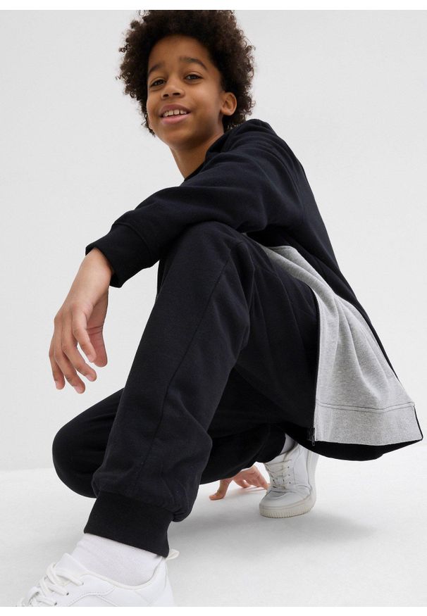 bonprix - Spodnie sportowe z miękkiej mieszanki z bawełny. Kolor: czarny. Materiał: bawełna. Styl: sportowy