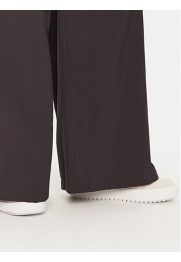 Champion Spodnie dresowe 117472 Czarny Wide Leg. Kolor: czarny. Materiał: syntetyk