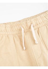 COCCODRILLO - Coccodrillo Spodnie dresowe WC3120103SKK Beżowy Slim Fit. Kolor: beżowy. Materiał: bawełna, dresówka #3