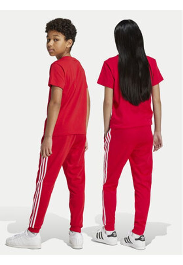 Adidas - adidas Spodnie dresowe adicolor SST IX7631 Czerwony Regular Fit. Kolor: czerwony. Materiał: syntetyk