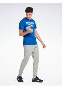 Reebok Spodnie dresowe Identity IA4345 Szary Regular Fit. Kolor: szary. Materiał: bawełna, dresówka