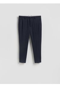 Reserved - Spodnie chino slim fit - granatowy. Kolor: niebieski. Materiał: wiskoza, dzianina #1