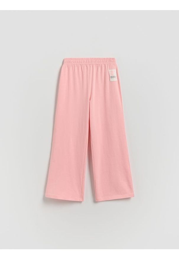 Reserved - Dresowe spodnie wide leg - brzoskwiniowy. Kolor: pomarańczowy. Materiał: dresówka