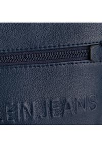 Calvin Klein Jeans Saszetka Micro Pebble Eu Flat Pack K50K504908 Granatowy. Kolor: niebieski. Materiał: skóra