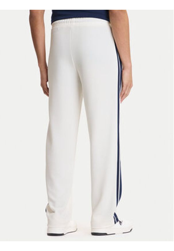 Guess Spodnie dresowe Z6GB14 K3211 Écru Regular Fit. Kolor: kremowy. Materiał: syntetyk