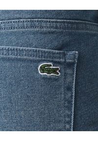 Lacoste - LACOSTE - Elastyczne jeansy skinny z haftem krokodyla. Stan: podwyższony. Kolor: niebieski. Wzór: haft