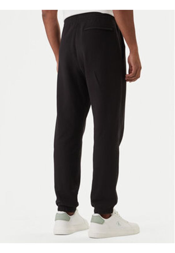 Calvin Klein Spodnie dresowe Eu Sportswear Graphic LV04LF236G Czarny Regular Fit. Kolor: czarny. Materiał: bawełna