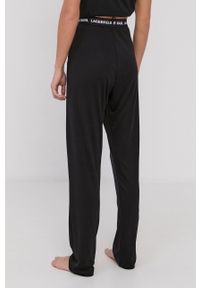 Karl Lagerfeld Spodnie piżamowe damskie kolor czarny. Kolor: czarny. Materiał: dzianina, jedwab, bawełna, tkanina, materiał, lyocell. Wzór: melanż