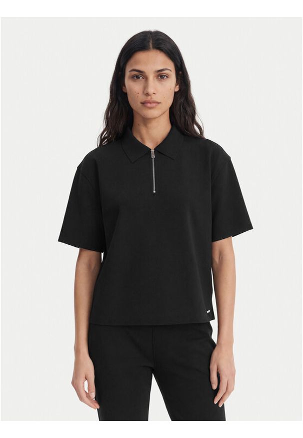 Calvin Klein Polo LV044E241G Czarny Relaxed Fit. Typ kołnierza: polo. Kolor: czarny. Materiał: syntetyk