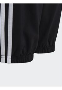 Adidas - adidas Spodnie dresowe Essentials 3-Stripes Woven Tracksuit Bottoms HR6334 Czarny Slim Fit. Kolor: czarny. Materiał: syntetyk #2