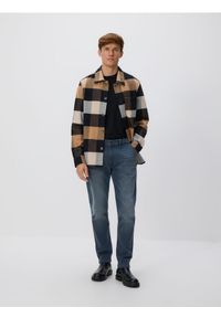 Reserved - Jeansy slim fit z efektem sprania - granatowy. Kolor: niebieski #1