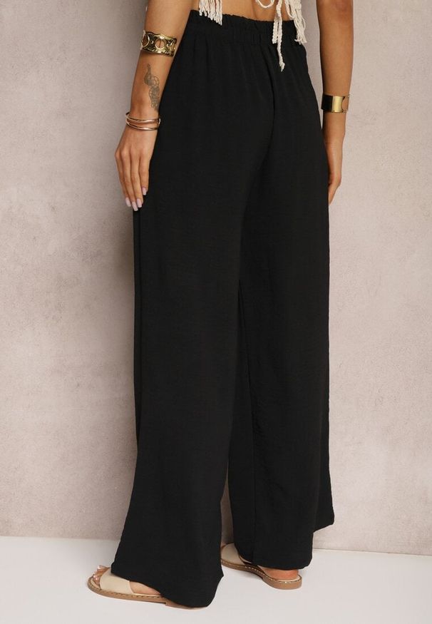 Renee - Czarne Spodnie w Stylu Alladynek High Waist Wykończone Gumką w Pasie Riselma. Okazja: na co dzień. Stan: podwyższony. Kolor: czarny. Styl: sportowy, casual