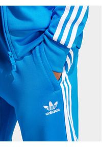 Adidas - adidas Spodnie dresowe adicolor Classics SST IM4542 Niebieski Slim Fit. Kolor: niebieski. Materiał: syntetyk, bawełna