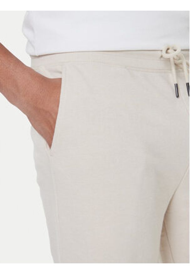 TOMMY HILFIGER - Tommy Hilfiger Szorty sportowe UM0UM03452 Écru Relaxed Fit. Materiał: bawełna. Styl: sportowy