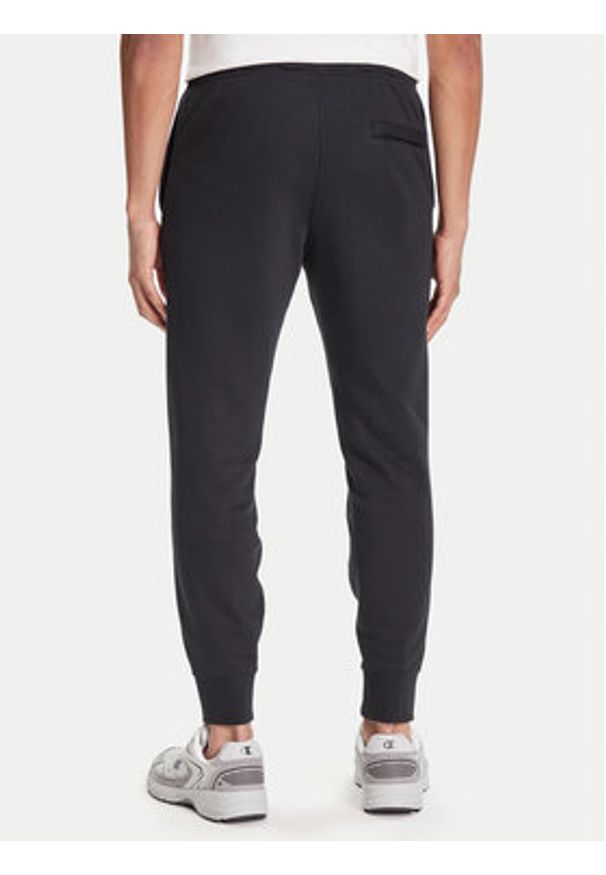 Nike Spodnie dresowe Club Fleece FN3801 Czarny Regular Fit. Kolor: czarny. Materiał: bawełna