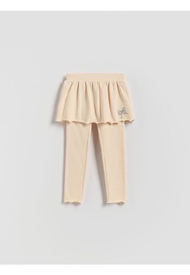 Reserved - Spodnie ze spódnicą - kremowy. Kolor: kremowy. Materiał: bawełna