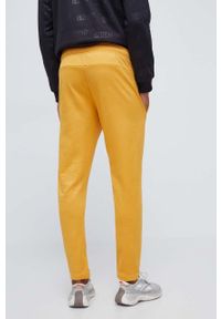 Adidas - adidas spodnie dresowe kolor żółty wzorzyste. Kolor: żółty. Materiał: dresówka #2