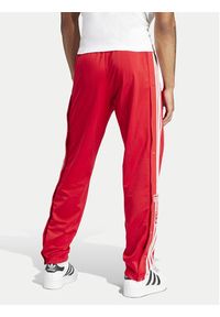 Adidas - adidas Spodnie dresowe adicolor Classics Adibreak IM8221 Czerwony Regular Fit. Kolor: czerwony. Materiał: syntetyk