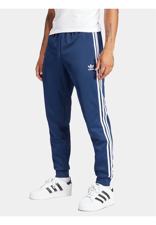 Adidas - adidas Spodnie dresowe adicolor Classics SST IR9887 Granatowy Slim Fit. Kolor: niebieski. Materiał: syntetyk, bawełna