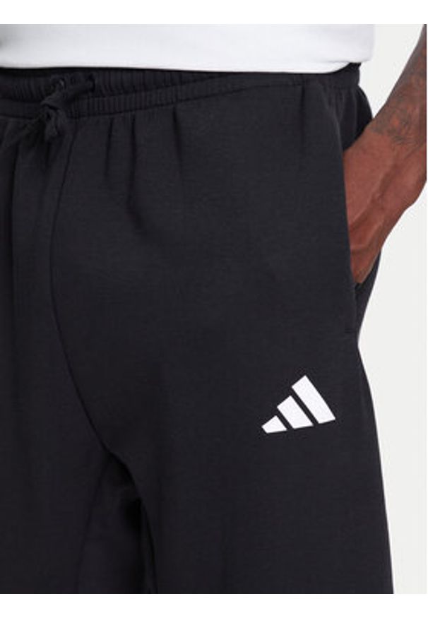 Adidas - adidas Spodnie dresowe Future Icons 3-Stripes JD4863 Czarny Regular Fit. Kolor: czarny. Materiał: syntetyk, bawełna