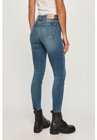 Calvin Klein Jeans - Jeansy CKJ011. Kolor: niebieski. Materiał: bawełna, poliester, denim, elastan. Wzór: gładki #2