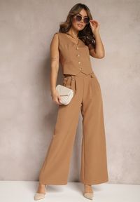 Renee - Brązowe Eleganckie Spodnie Dzwony z Ozdobnymi Patkami w Pasie Nattas. Stan: podwyższony. Kolor: brązowy. Styl: elegancki