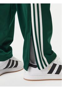 Adidas - adidas Spodnie dresowe Firebird KD8317 Zielony Loose Fit. Kolor: zielony. Materiał: syntetyk #3