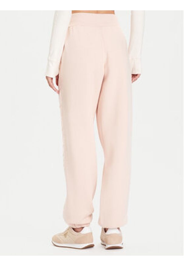 Guess Spodnie dresowe V5BB10 KB681 Różowy Regular Fit. Kolor: różowy. Materiał: syntetyk, bawełna