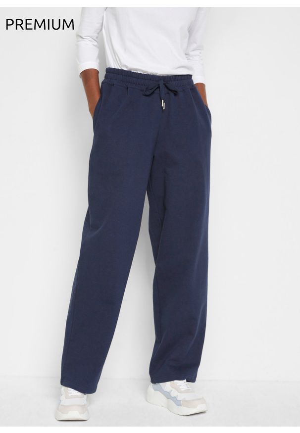 bonprix - Spodnie dresowe Essential, szerokie nogawki. Kolor: niebieski. Materiał: dresówka