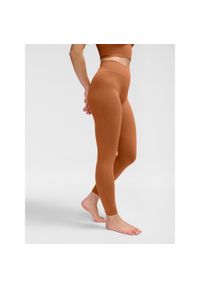 Damskie legginsy bezszwowe Hummel MT Adapt MW. Kolor: czerwony, brązowy, wielokolorowy. Sport: joga i pilates
