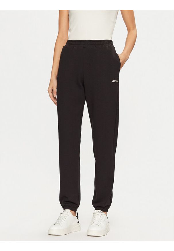 Guess Spodnie dresowe V5RB02 KCLD1 Brązowy Regular Fit. Kolor: brązowy. Materiał: syntetyk