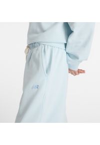 Spodnie damskie New Balance WP41513FRL – niebieskie. Stan: podwyższony. Kolor: niebieski. Materiał: bawełna, dresówka. Wzór: ze splotem #5