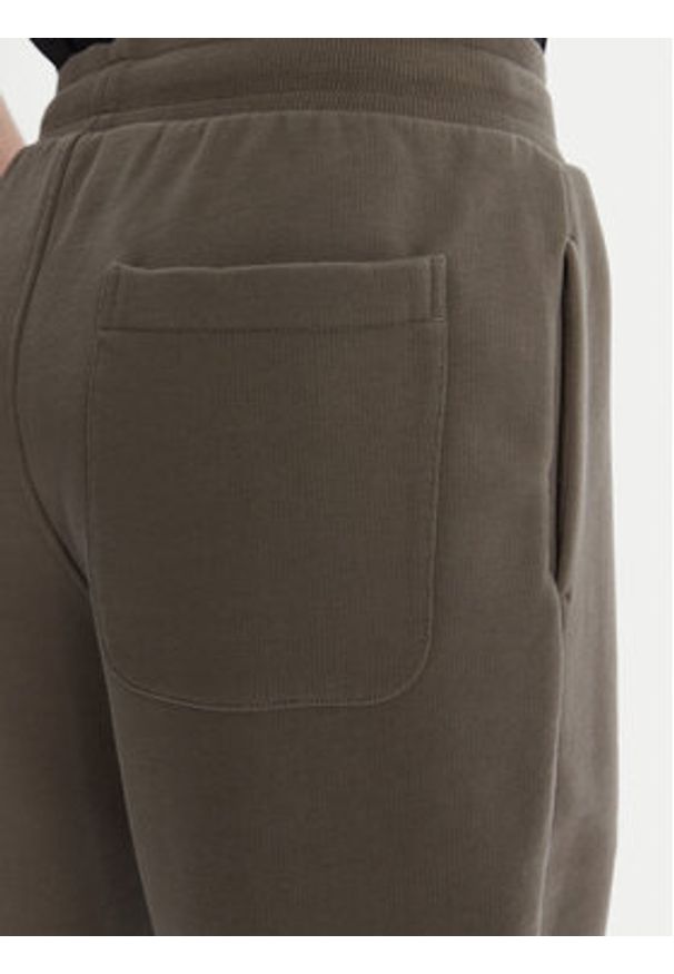 AMI PARIS - AMI Paris Spodnie dresowe UTR240.747 Khaki Regular Fit. Kolor: brązowy. Materiał: bawełna