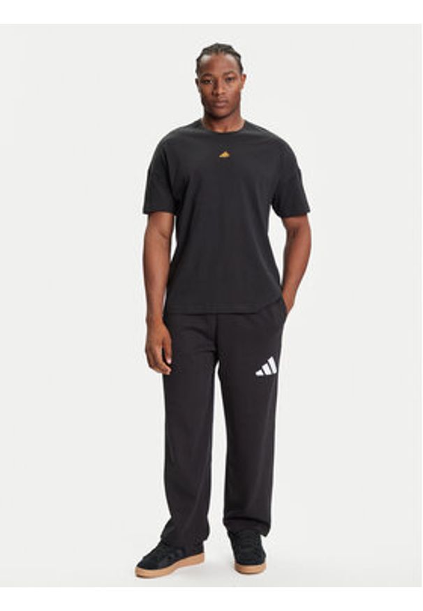 Adidas - adidas Spodnie dresowe Essentials JF3567 Czarny Loose Fit. Kolor: czarny. Materiał: bawełna