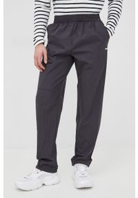 Rains spodnie 18700 Woven Pants Regular kolor czarny proste high waist. Stan: podwyższony. Kolor: czarny. Materiał: tkanina