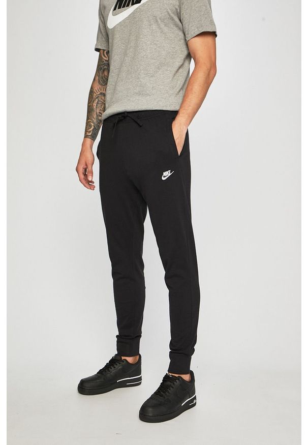 Nike Sportswear - Spodnie. Kolor: czarny. Materiał: bawełna, dzianina