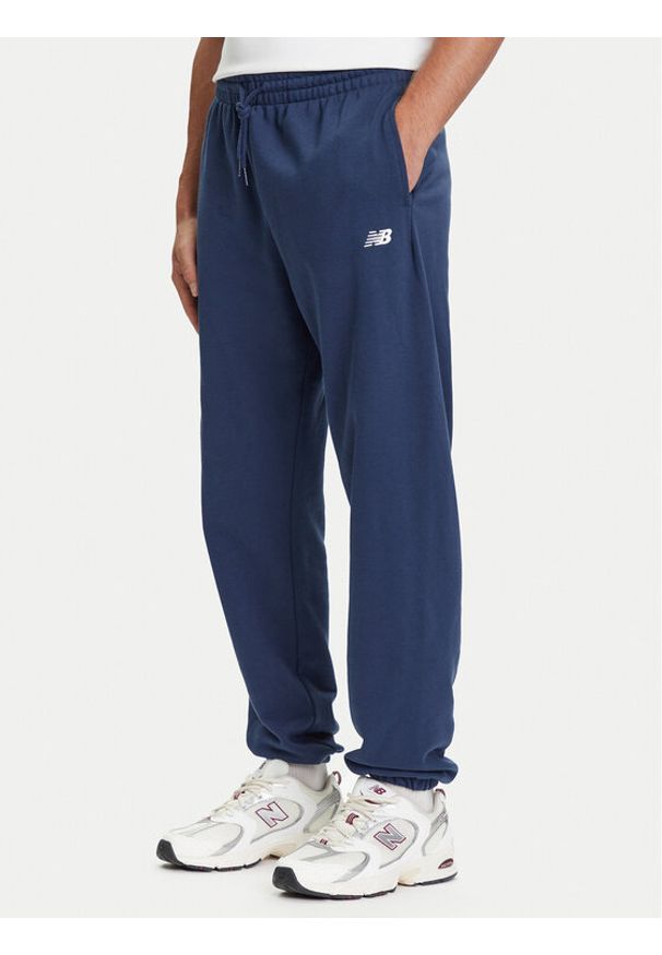 New Balance Spodnie dresowe Essentials MP41519 Granatowy Relaxed Fit. Kolor: niebieski. Materiał: bawełna