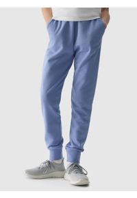4F JUNIOR - Spodnie dresowe joggery dziewczęce - denim. Okazja: na co dzień. Kolor: niebieski. Materiał: dresówka, denim. Wzór: ze splotem, gładki. Styl: casual, sportowy