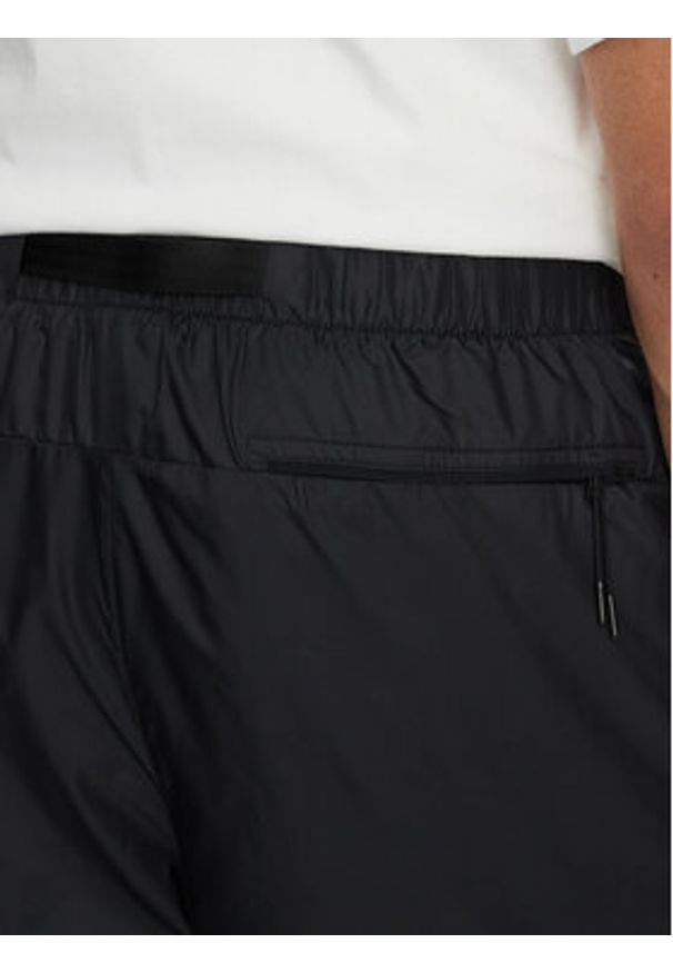 Nike Spodnie dresowe FB7911 010 Czarny Regular Fit. Kolor: czarny. Materiał: syntetyk