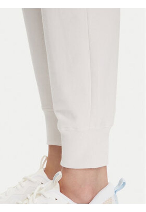 DKNY Sport Spodnie dresowe DP5P3496 Beżowy Regular Fit. Kolor: beżowy. Materiał: bawełna