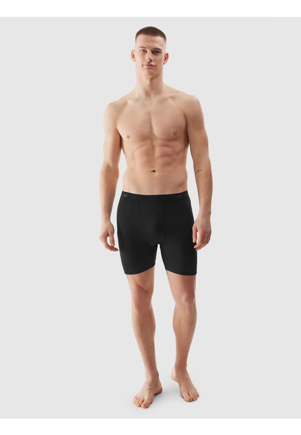 4f - Spodenki rowerowe z żelową wkładką męskie - czarne. Kolor: czarny. Materiał: elastan, materiał, włókno, dzianina, syntetyk. Długość: krótkie. Wzór: ze splotem, gładki, jednolity. Sport: kolarstwo