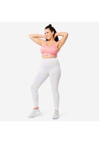 DOMYOS - Stanik sportowy Domyos. Kolekcja: plus size. Kolor: różowy. Materiał: materiał, elastan, skóra. Długość rękawa: na ramiączkach. Sport: fitness
